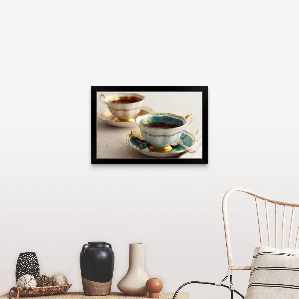 "Elegant tea cups and saucers, close-up" Black Framed Print