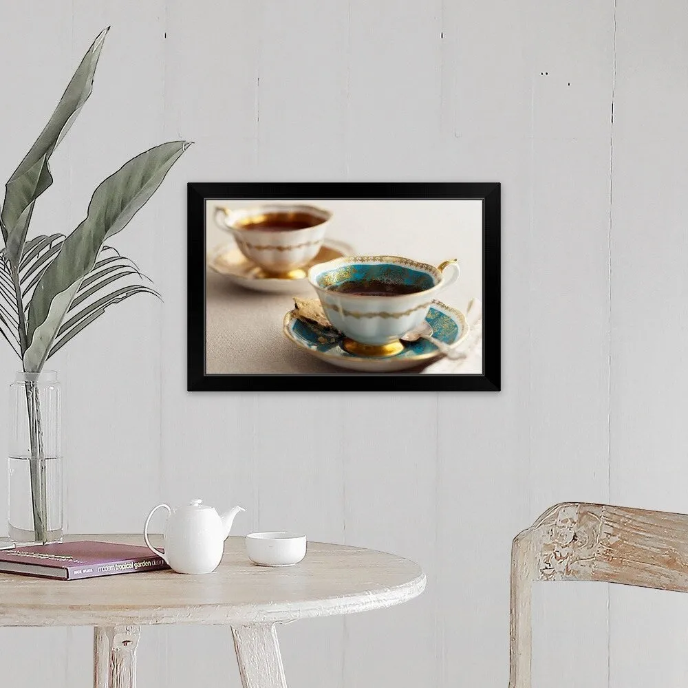 "Elegant tea cups and saucers, close-up" Black Framed Print